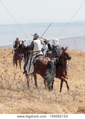 Tiberias Israel July 01 2017 : Participants in the reconstruction of Horns of Hattin battle in 1187 participate in the battle on horseback on the battlefield near Tiberias Israel