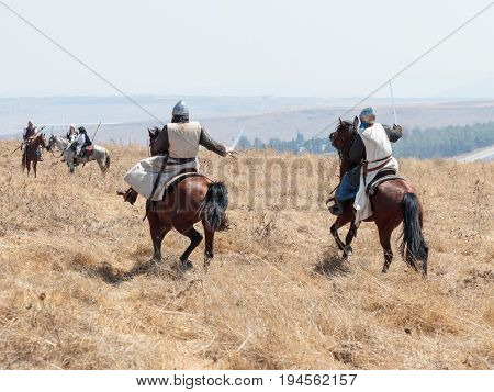 Tiberias Israel July 01 2017 : Participants in the reconstruction of Horns of Hattin battle in 1187 participate in the battle on horseback on the battlefield near Tiberias Israel