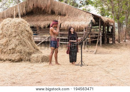 Asian beautiful girl are happy playing Pong Lang is a Thai musical instrument in summer at Countryside.
