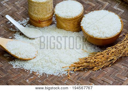 Jasmine Rice, Rice In Wooden Bowl, Basmati Rice, Rice Is On  Wooden Floor As The Background.