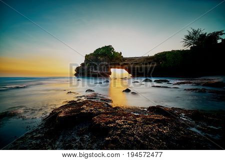 Peaceful Seascape With Warm Sunlight At Tanah Lot Temple Located In Bali Indonesia