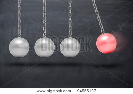 Newton's cradle pendulum on blackboard, abstract image