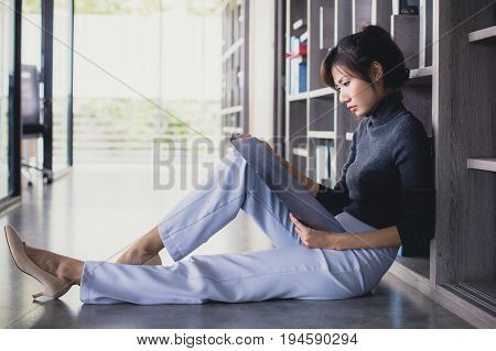 Asian Women Working With Stressful Alone At Office, Women Working Concept, Vintage Tone.