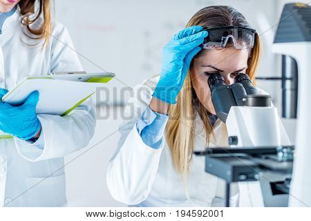 Biotechnology In The Lab, Tone Dimahe, Two People