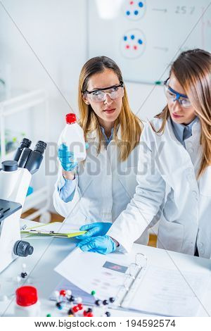 Biotechnology In The Lab, Tone Dimahe, Two People