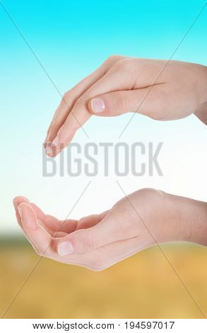 Female's hands in a roung shape.