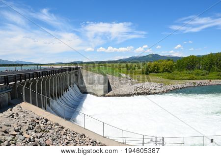 JACKSON HOLE, WYOMING - JUNE 26, 2017: Jackson Lake Dam. Built in 1911 in Grand Teton National Park, it has enlarged the natural lake that is primarily fed by the Snake River.