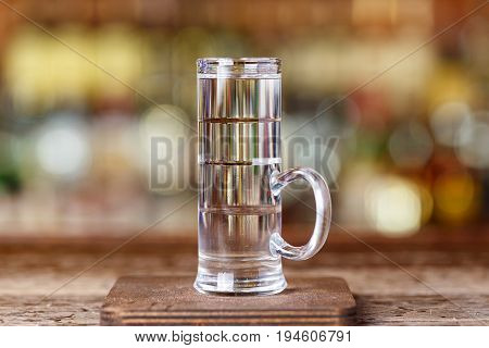 cocktail on the basis of different types of alcohol: sambuca coconut and citrus liqueur white rum. Space for text
