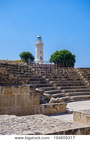Antient greek amphitheater and lighthouse in Archeological park in Paphos, Cyprus