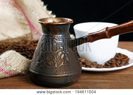 Turka With Coffee On The Table Next To Coffee Beans