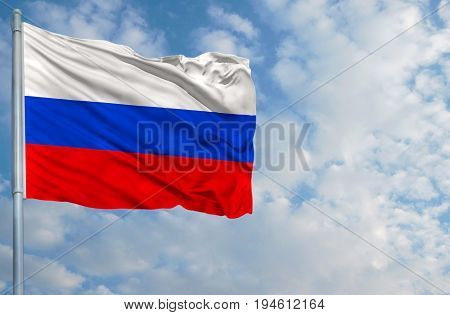 National flag of Russia on a flagpole in front of blue sky.
