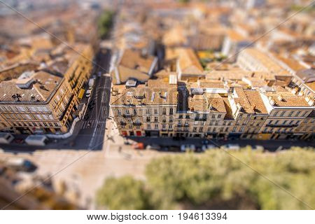 Aerial cityscape view on the old town of Bordeaux city during the sunny day in France. Tilt-shift image technic