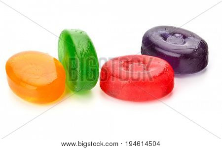 Four colorful fruit hard sugar candies,  boiled sweeties or sugar plums isolated on white background cutout