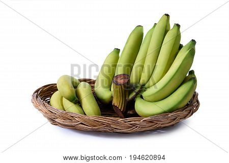 Yellowish green bananas in a basket isolated on white background