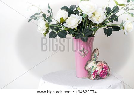 Rose placed on the desk in blue background