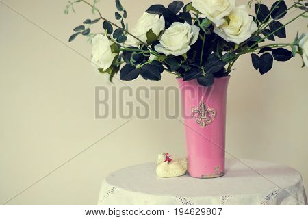 Rose placed on the desk in blue background