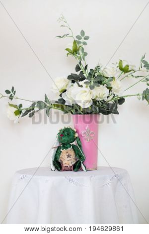 Rose placed on the desk in blue background