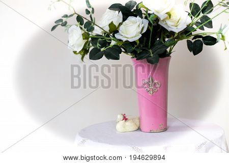 Rose placed on the desk in blue background