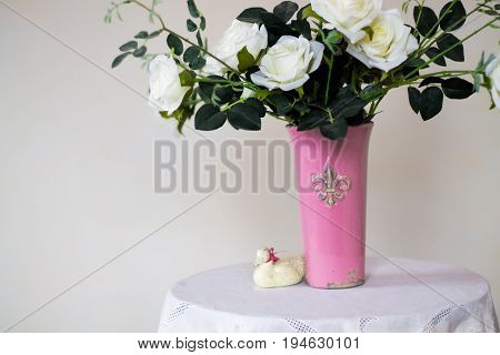 Rose placed on the desk in blue background