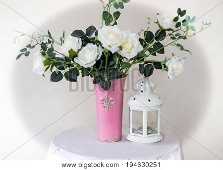 Rose placed on the desk in blue background