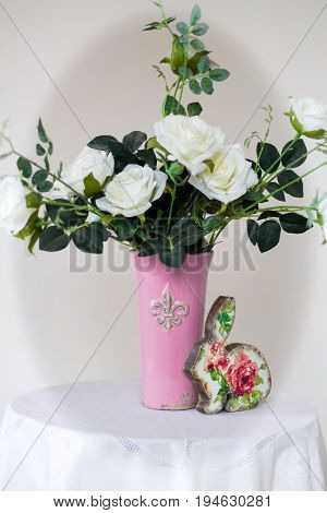 Rose placed on the desk in blue background