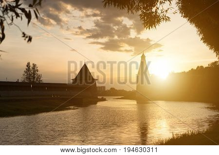 High And Flat Towers Of The Pskov Fortress On The Sunset.