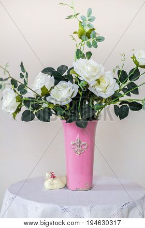 Rose placed on the desk in blue background