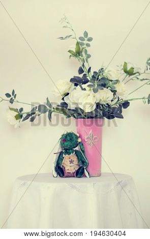 Rose placed on the desk in blue background