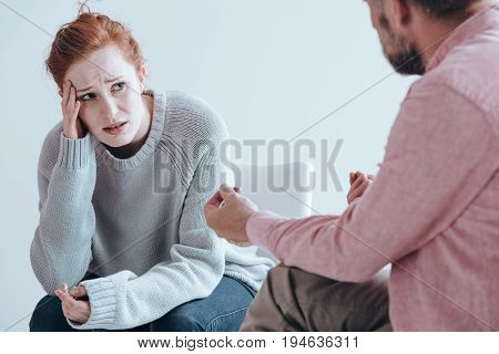 Therapist cheering up his extremely depressed patient