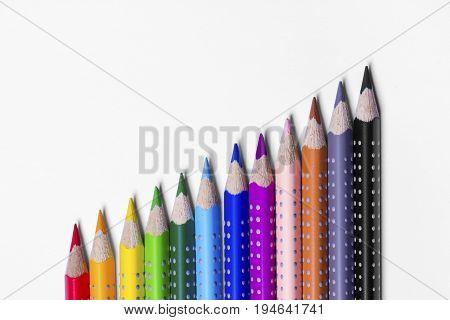 12 colorful paint pens on white background