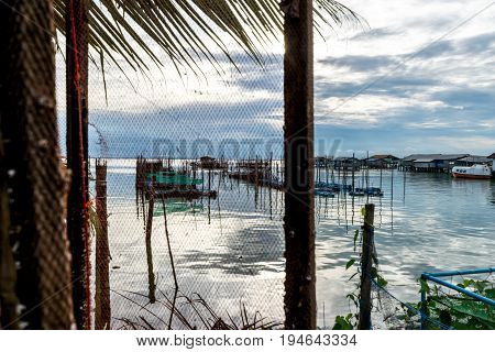 Homestay and floating basket in lake at Kohyo Songkhla Thailand with beautiful sky and clouds. This is traditional fisheries area.