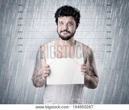 Gangster with rainy, lowering background and table on his hand.
