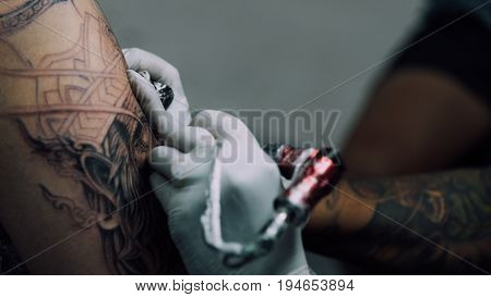 Tattoo Artist Drawing Art On Body