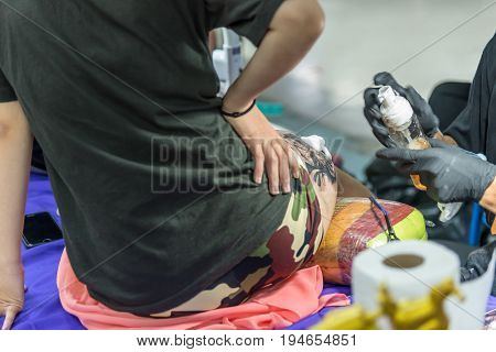 Tattoo Artist Drawing Art On Body