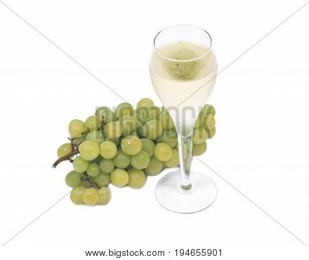Glass of white wine and ripe organic green grapes isolated on white background
