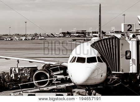 Commercial jet at the gate going through pre-flight preparations.