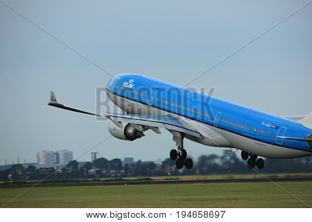 Amsterdam the Netherlands - July 6th 2017: PH-AKB KLM Royal Dutch Airlines Airbus A330 takeoff from Polderbaan runway Amsterdam Schiphol Airport