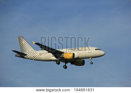 Amsterdam the Netherlands - July 7th 2017: EC-MIQ Vueling Airbus A319 approaching Schiphol Amsterdam Airport Polderbaan runway