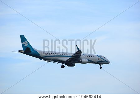 Amsterdam the Netherlands - July 7th 2017: I-ADJO Air Dolomiti Embraer ERJ-195LR approaching Schiphol Amsterdam Airport Polderbaan runway