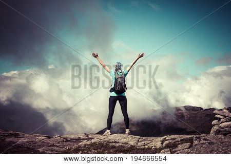 Hiker on the mountain top. Sport and active life concept. Trolltunga Norway