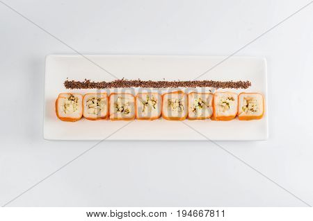 Dessert Maki Sushi - Roll With Various Fruit In Rice Pudding And Coconut Flakes