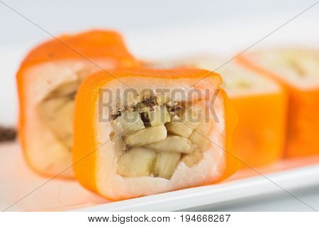 Dessert Maki Sushi - Roll With Various Fruit In Rice Pudding And Coconut Flakes