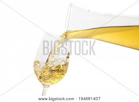 White wine pouring down from a wine decanter on white background