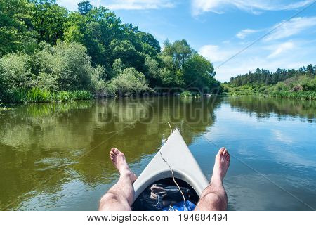 A Man Relaxing On Kayak