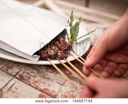Arrosticini meat for Take away inside an envelope