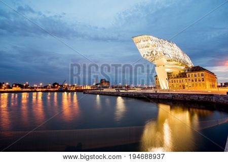 ANTWERPEN, BELGIUM - June 02, 2017: Night view on the illuminated Port House building designed by Zaha Hadid architect in 2009 in Antwerpen city, Belgium