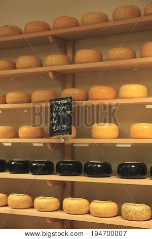 Traditional Dutch cheeses on display in a store
