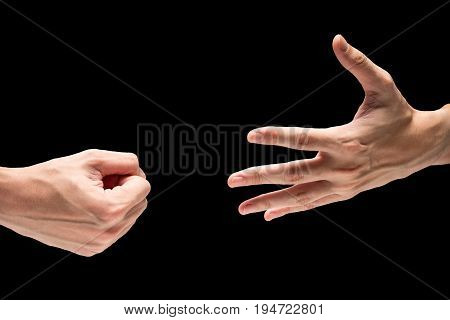 Hand symbol with rock paper scisors on a black background.