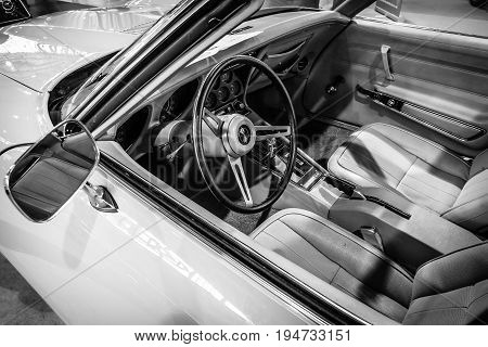 STUTTGART GERMANY - MARCH 17 2016: Cabin of sports car Chevrolet Corvette Stingray Coupe (C3) 1975. Black and white. Europe's greatest classic car exhibition 