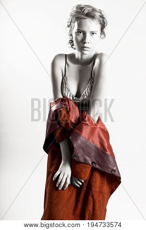 Beautiful half-naked girl in an orange coat covers his body